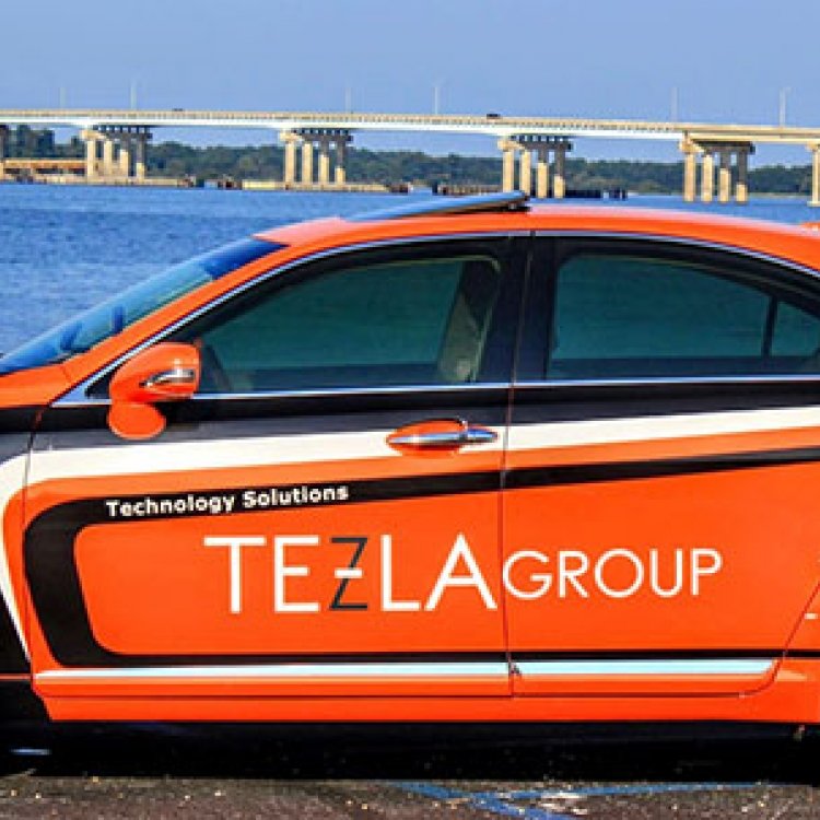 Tezla Group car with Cambridge Bridge in background