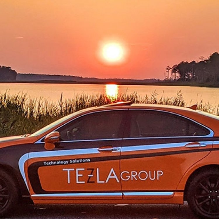 Tezla Group car in front of sunset